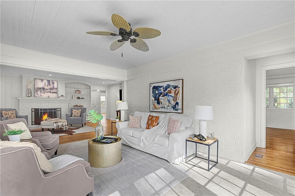 3819 North Stratford Road Northeast Atlanta, GA 30342 - Photo 20 of 48 a living room with furniture and a view of kitchen
