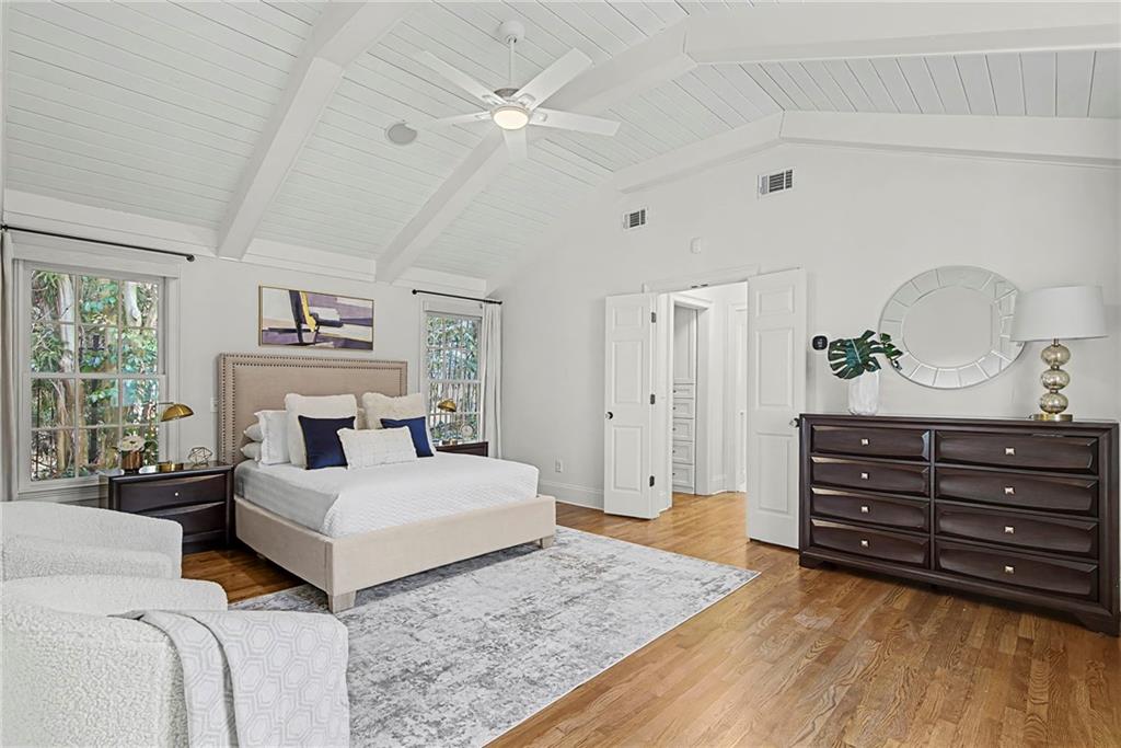 3819 North Stratford Road Northeast Atlanta, GA 30342 - Photo 25 of 48 a bedroom with a bed and a dresser