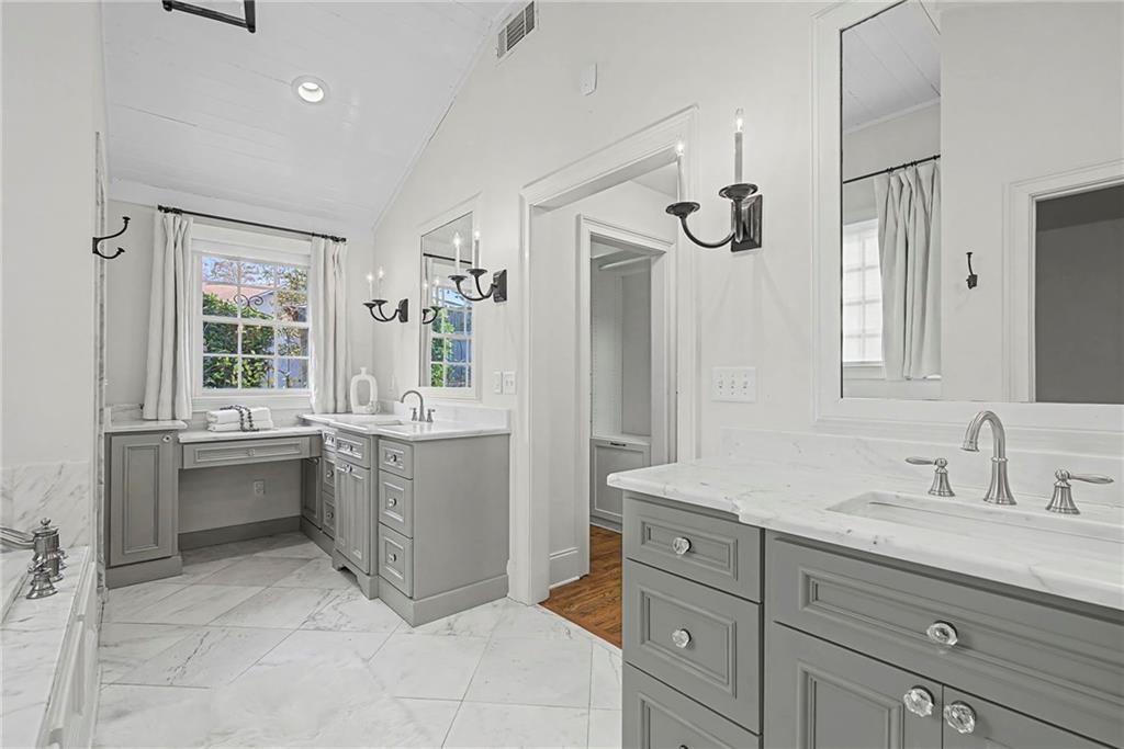 3819 North Stratford Road Northeast Atlanta, GA 30342 - Photo 28 of 48 a bathroom with a sink and a mirror