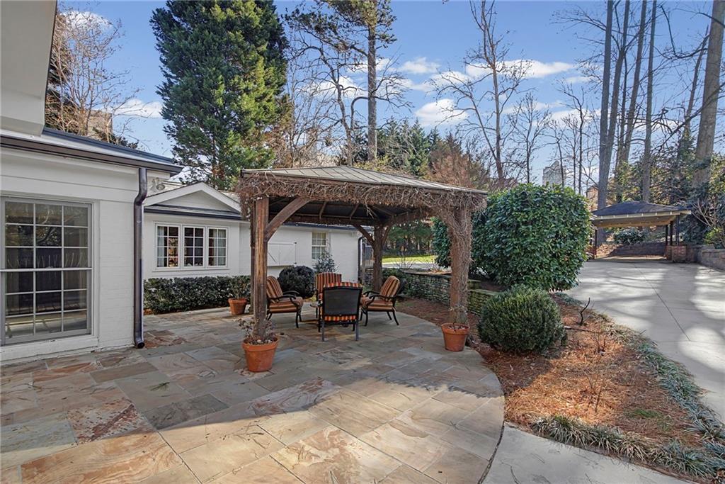 3819 North Stratford Road Northeast Atlanta, GA 30342 - Photo 37 of 48 a view of a house with backyard and sitting area