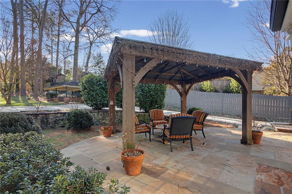 3819 North Stratford Road Northeast Atlanta, GA 30342 - Photo 38 of 48 a view of backyard with outdoor seating and green space