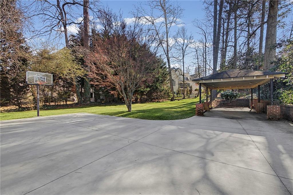 3819 North Stratford Road Northeast Atlanta, GA 30342 - Photo 39 of 48 a view of a playground with basketball court
