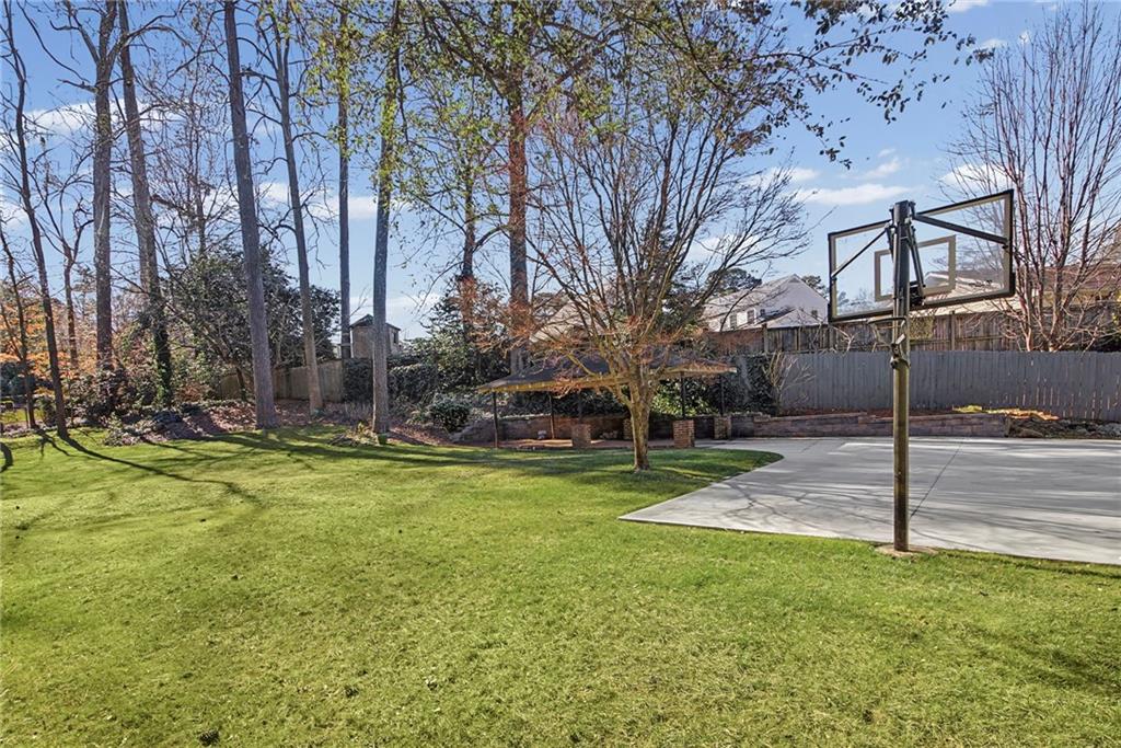 3819 North Stratford Road Northeast Atlanta, GA 30342 - Photo 40 of 48 a backyard of apartments with large trees