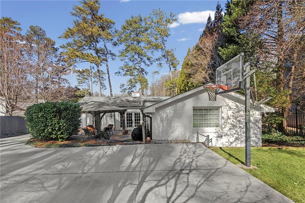 3819 North Stratford Road Northeast Atlanta, GA 30342 - Photo 41 of 48 a front view of a house with garden
