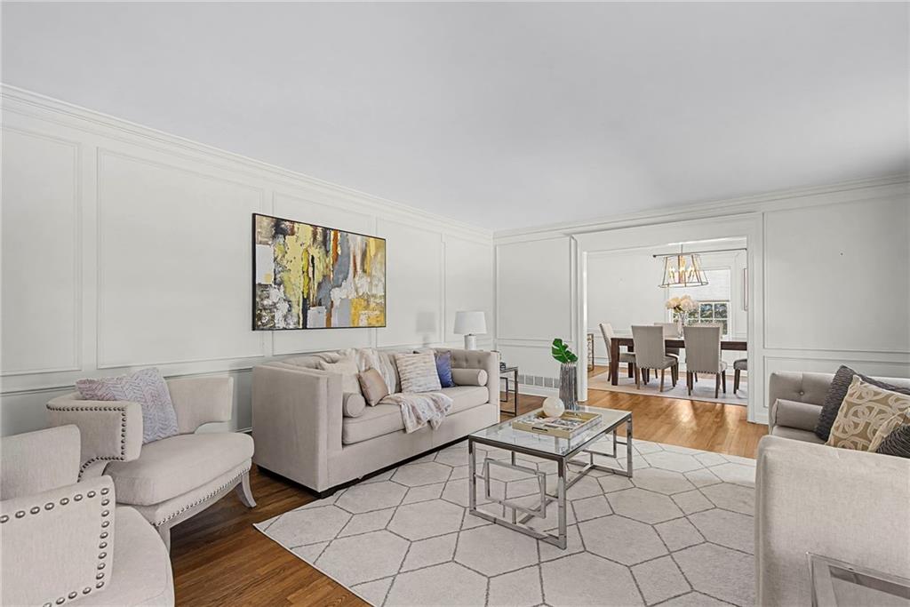3819 North Stratford Road Northeast Atlanta, GA 30342 - Photo 5 of 48 a living room with furniture and a rug
