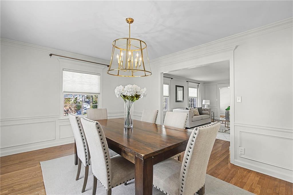 3819 North Stratford Road Northeast Atlanta, GA 30342 - Photo 8 of 48 a view of a dining room with furniture and chandelier