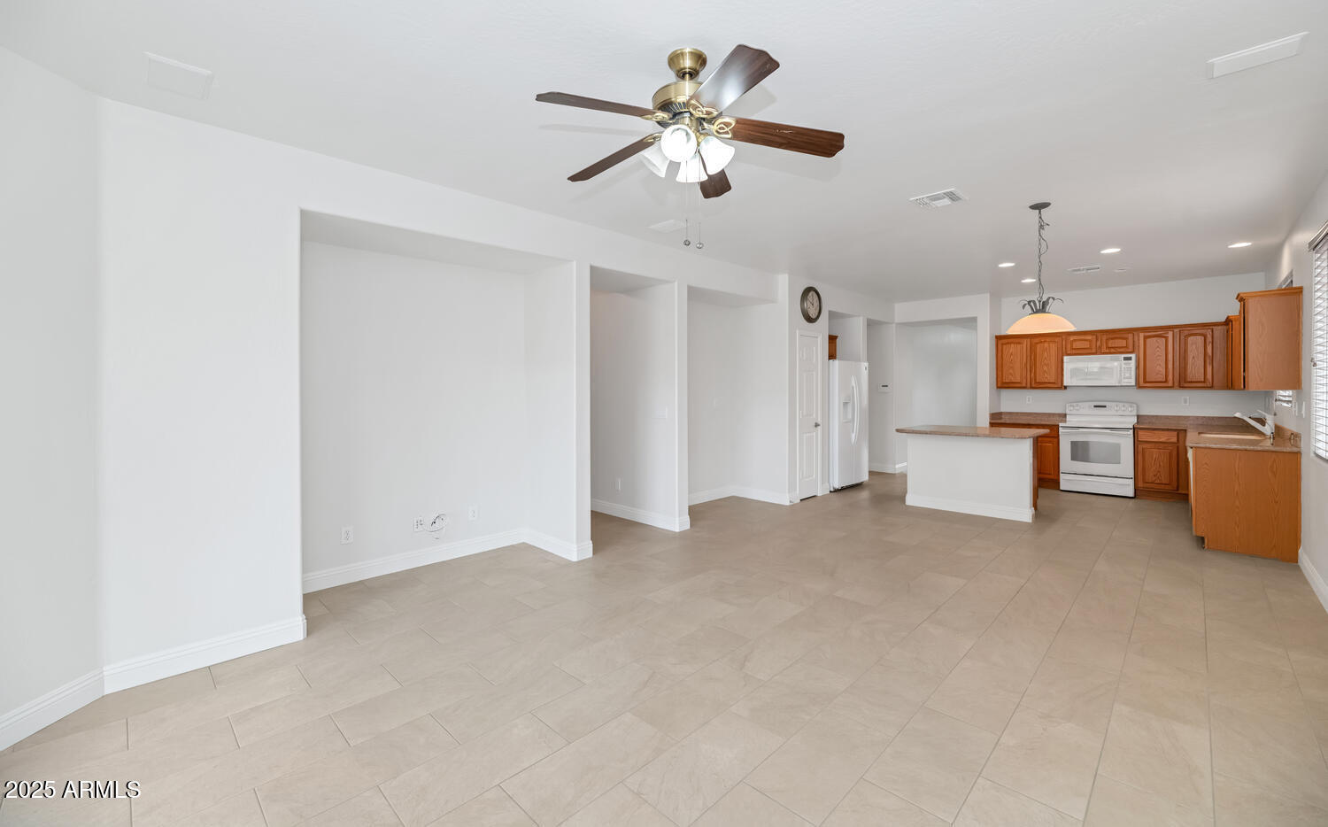 39148 North Acadia Way Anthem, AZ 85086 - Photo 12 of 34 a view of an empty room with kitchen