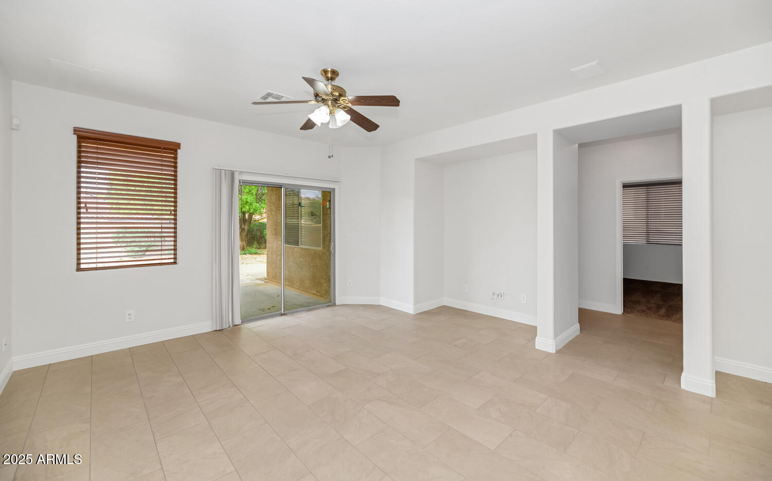 39148 North Acadia Way Anthem, AZ 85086 - Photo 13 of 34 a view of an empty room with a window