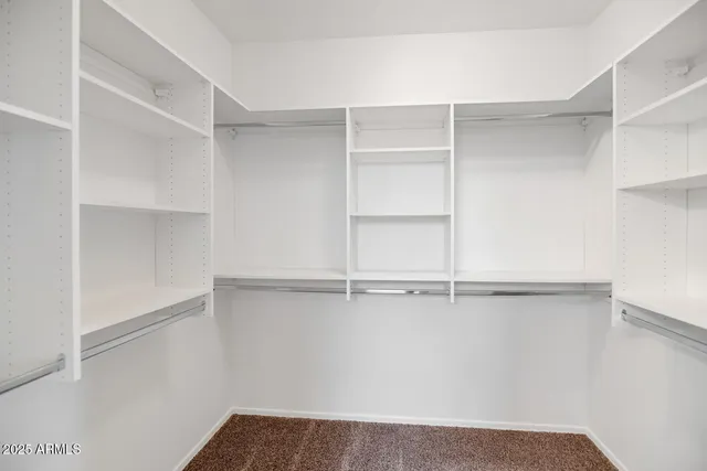 a view of an empty walk in closet