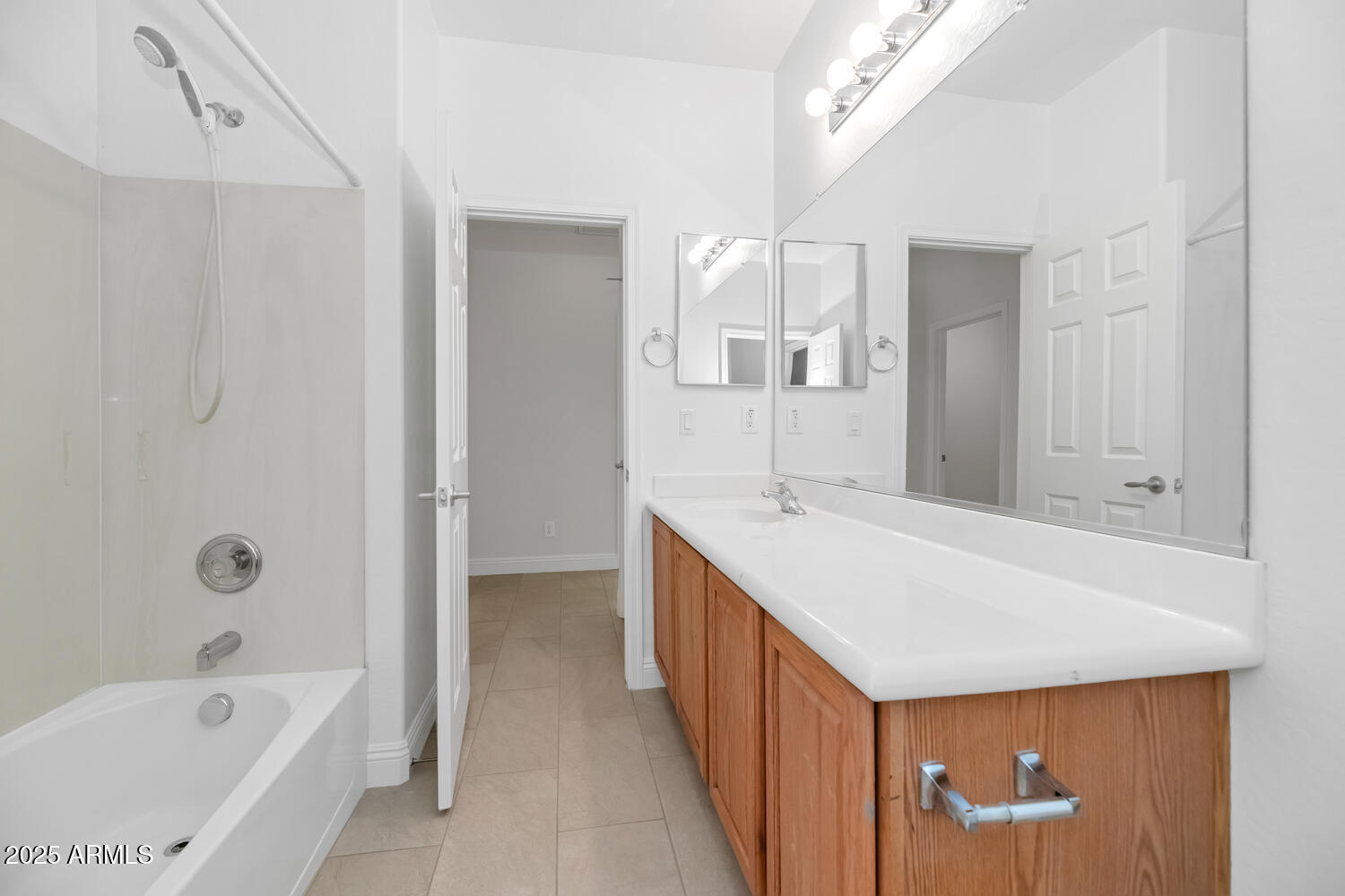 39148 North Acadia Way Anthem, AZ 85086 - Photo 19 of 34 a bathroom with a tub a sink and mirror