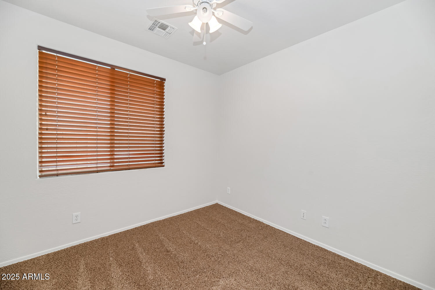 39148 North Acadia Way Anthem, AZ 85086 - Photo 21 of 34 an empty room with a window