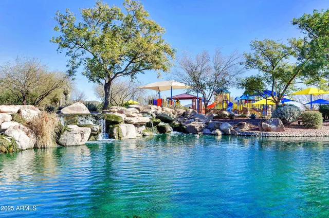a group of boats are docked in a blue swimming pool
