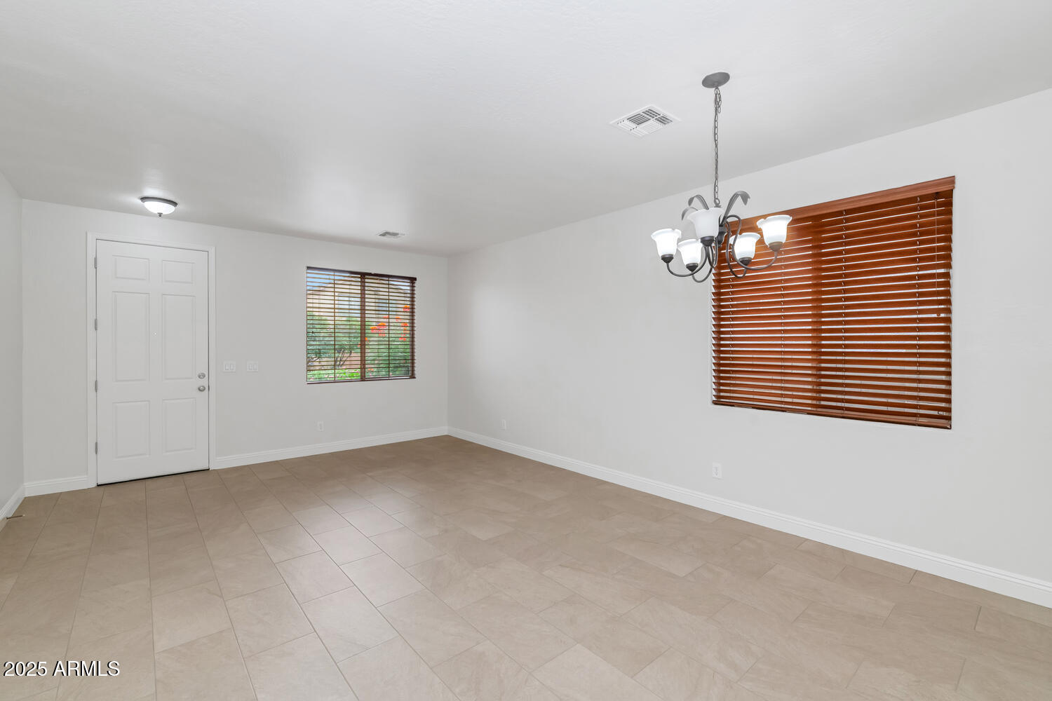 39148 North Acadia Way Anthem, AZ 85086 - Photo 6 of 34 a view of an empty room with a window