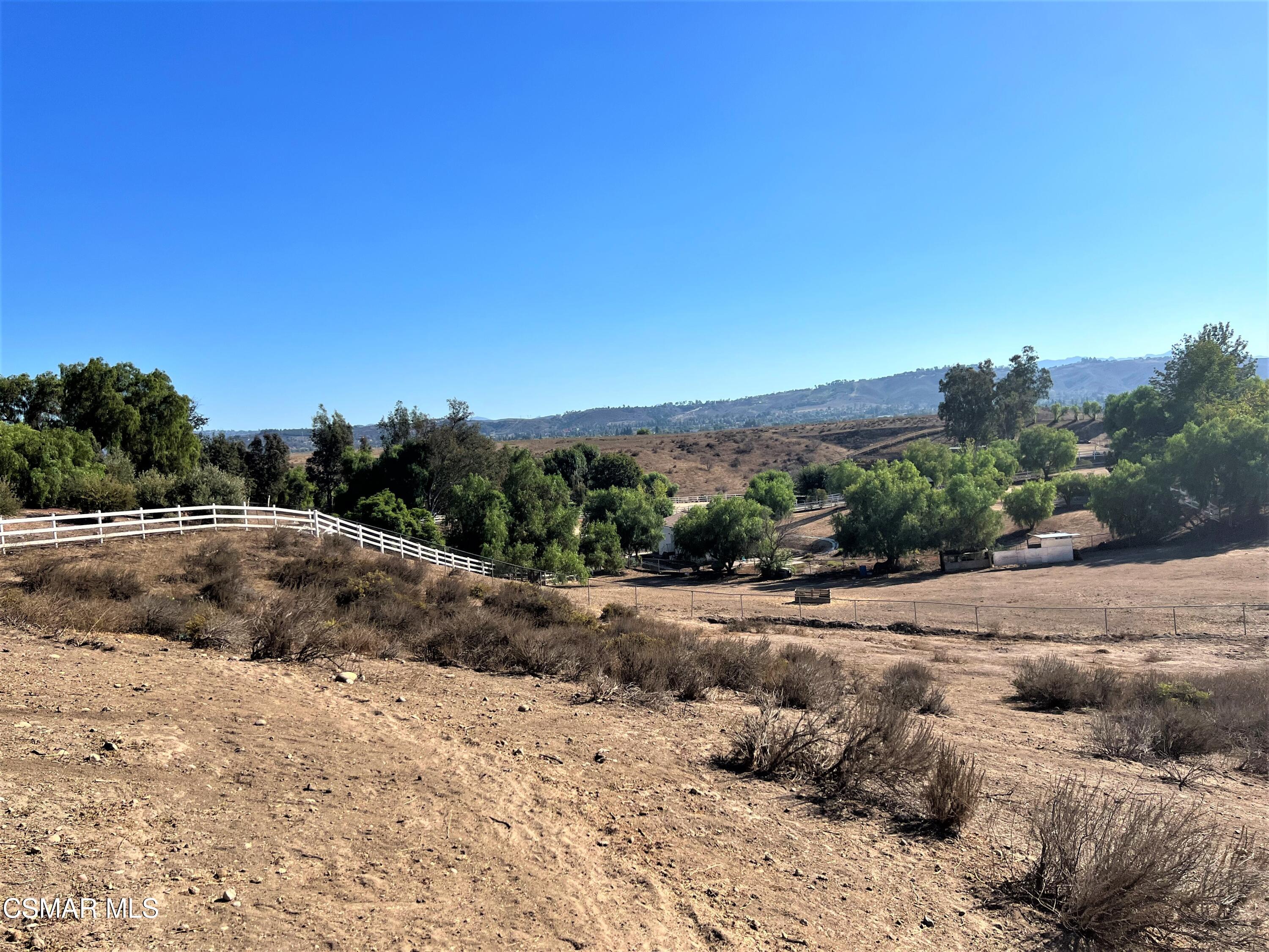 Darlene Lane Moorpark, CA 93021 - Photo 2 of 4 a view of a dry yard with trees