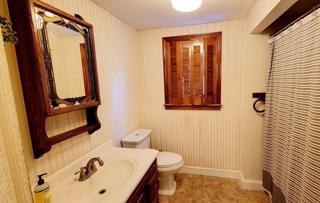 11 North Martin Road Amesbury, MA 01913 - Photo 12 of 28 a bathroom with a sink and a mirror