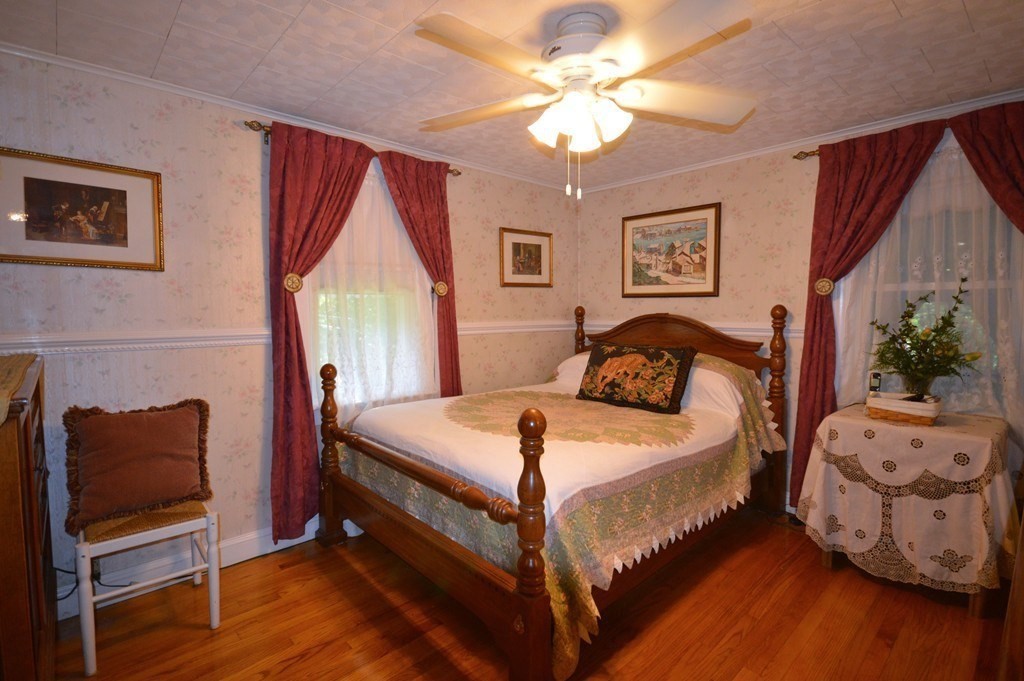 11 North Martin Road Amesbury, MA 01913 - Photo 14 of 28 a bedroom with a bed and a couch