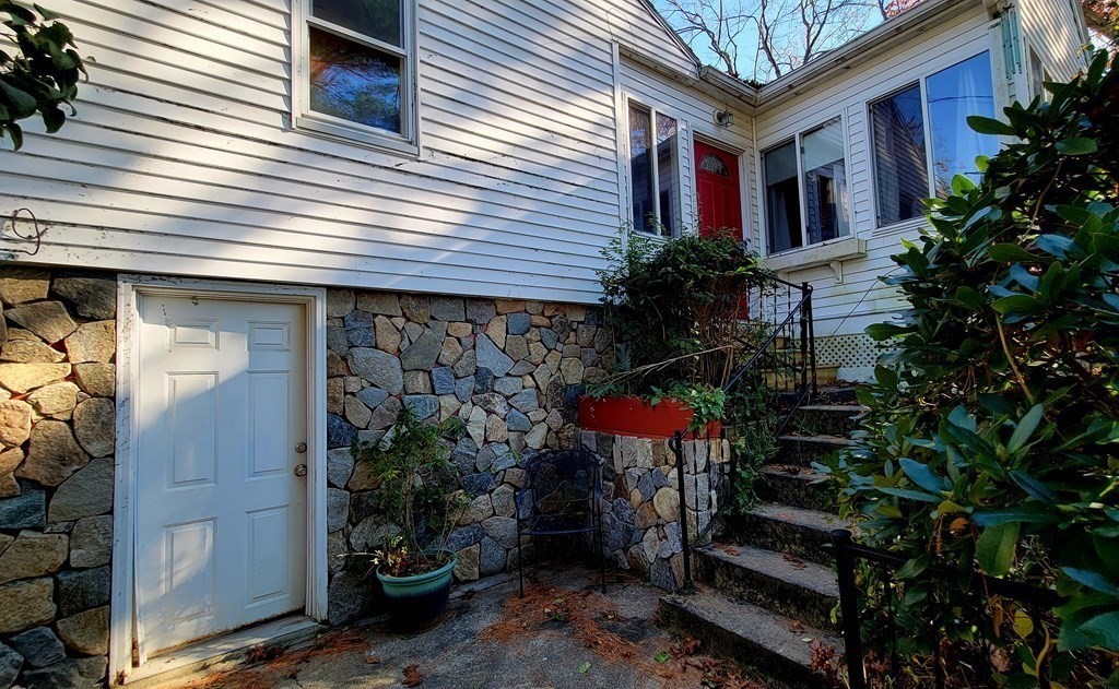 11 North Martin Road Amesbury, MA 01913 - Photo 2 of 28 a view of a house with a small yard and plants