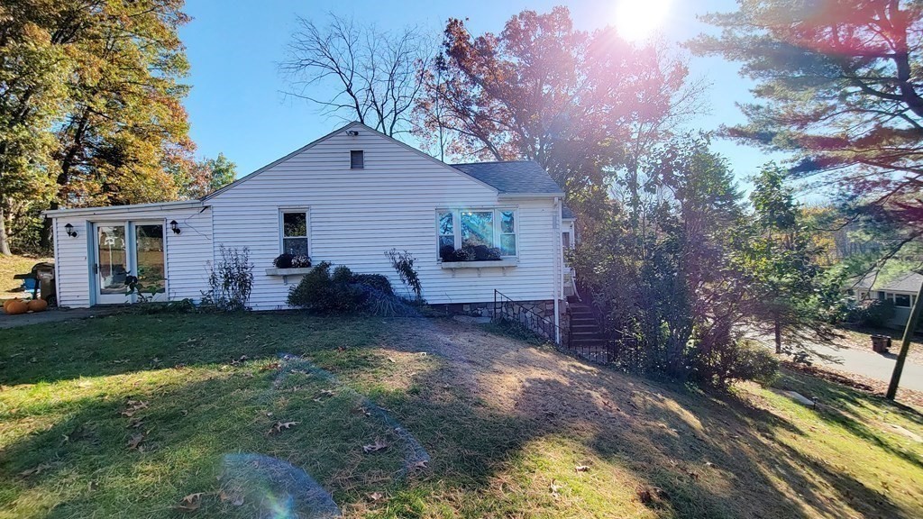 11 North Martin Road Amesbury, MA 01913 - Photo 26 of 28 a backyard of a house with table and chairs