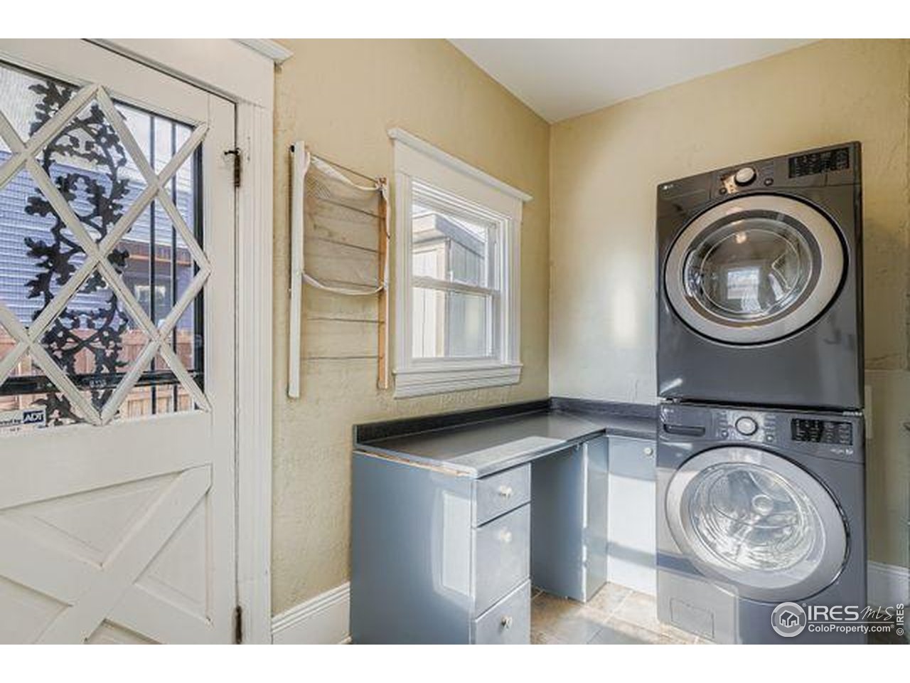 3001 North High Street Denver, CO 80205 - Photo 15 of 33 laundry with walkout to backyard - main level