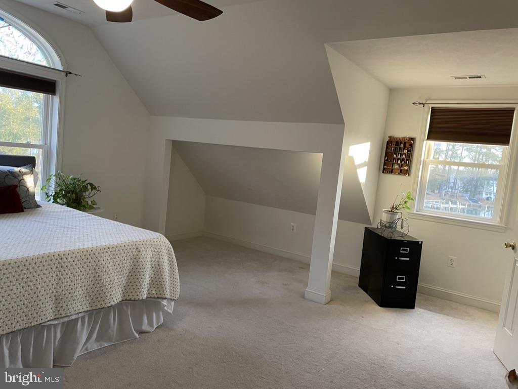 17451 Poplar Street Piney Point, MD 20674 - Photo 21 of 27 a bedroom with a bed and a window