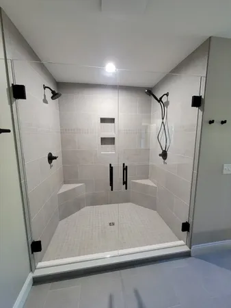 a bathroom with a bath tub and a shower