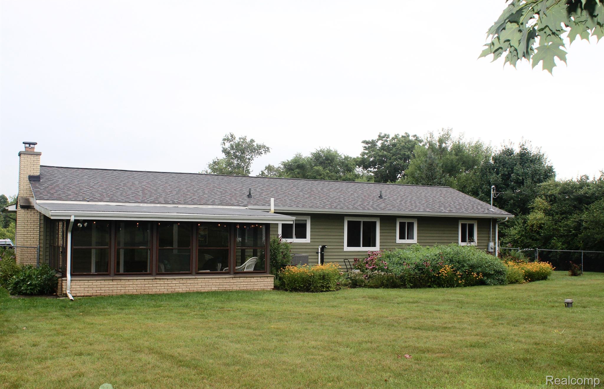 5691 Dexter-Pinckney Road Dexter, MI 48130 - Photo 3 of 34 Three season room overlooks back yard