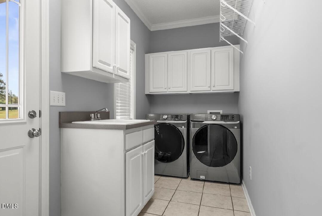 5780 McArthur Road Broadway, NC 27505 - Photo 19 of 40 a utility room with sink dryer and washer