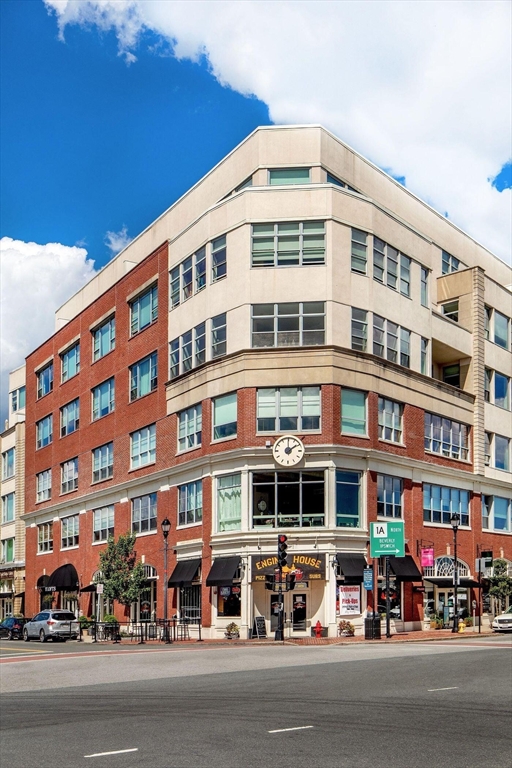 51 Lafayette Street, Unit 403 Salem, MA 01970 - Photo 13 of 13 a front view of a building with lot of cars and trees