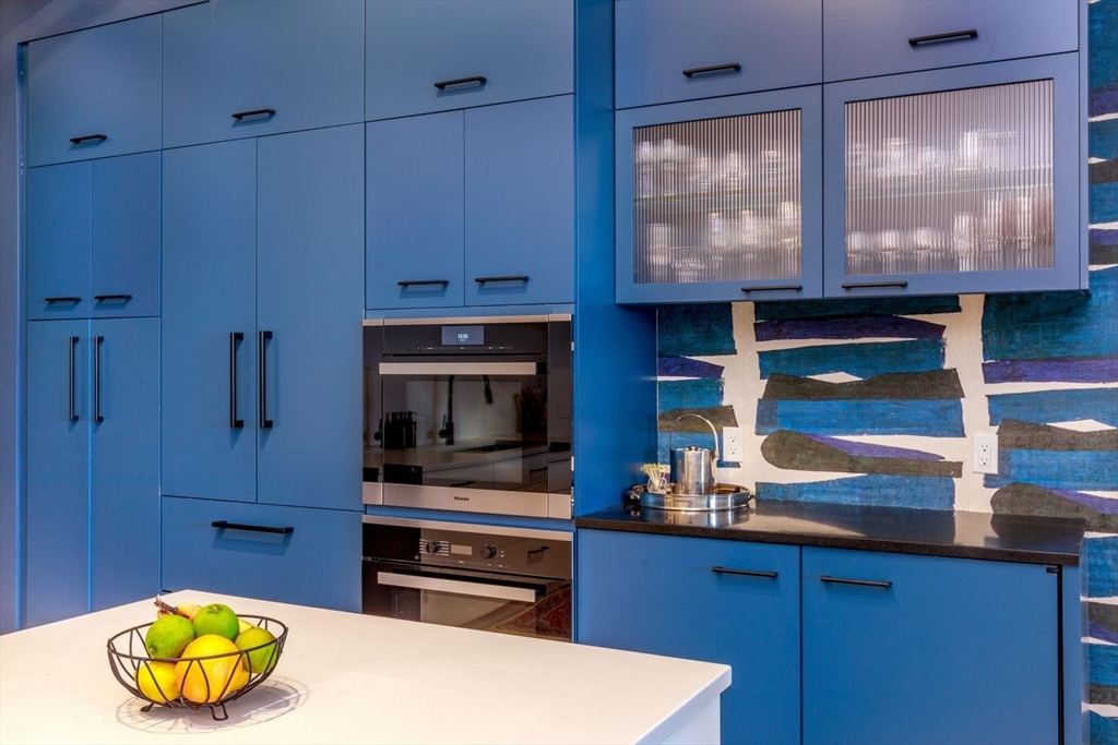 51 Lafayette Street, Unit 403 Salem, MA 01970 - Photo 5 of 13 a kitchen with a cabinets and appliances