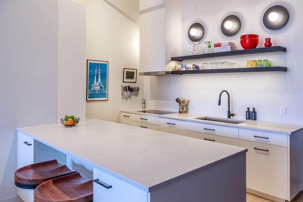 51 Lafayette Street, Unit 403 Salem, MA 01970 - Photo 6 of 13 a kitchen with stainless steel appliances a sink and a stove