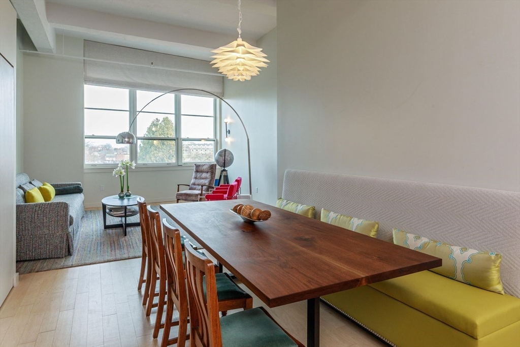 51 Lafayette Street, Unit 403 Salem, MA 01970 - Photo 7 of 13 a view of a dining room with furniture and a window