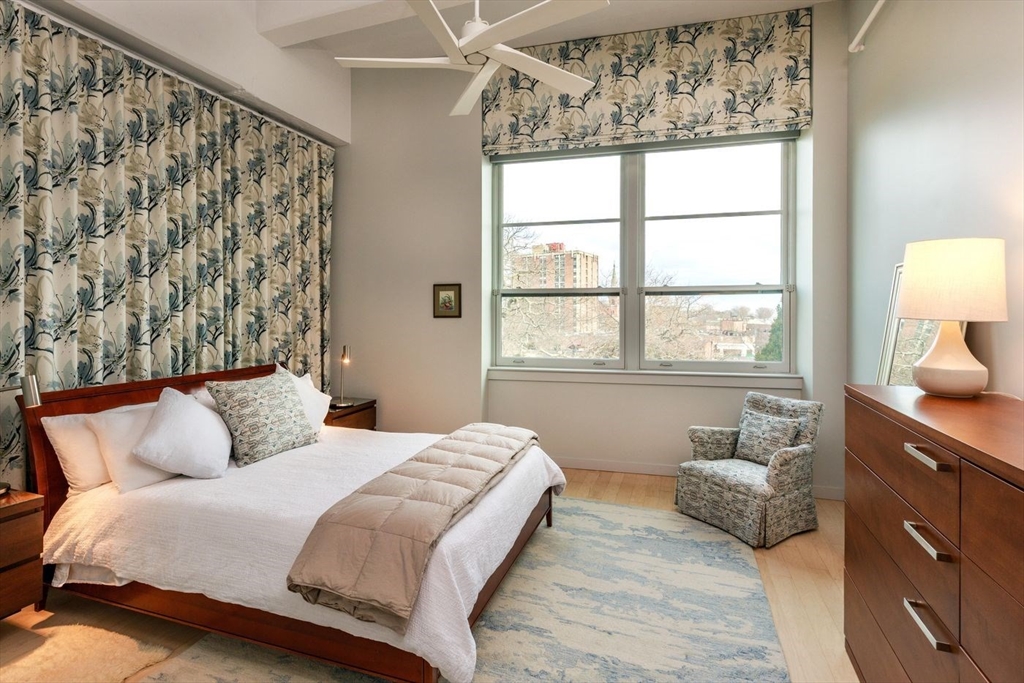 51 Lafayette Street, Unit 403 Salem, MA 01970 - Photo 8 of 13 a bedroom with a bed and a window