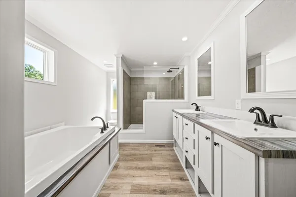 a white toilet sitting next to a bathroom sink