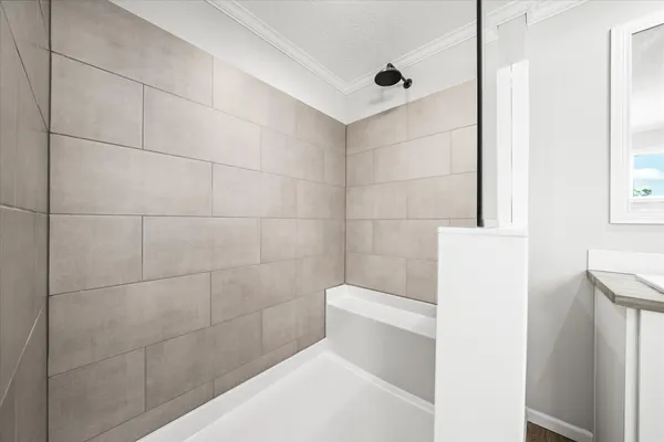 a bathroom with double sink and a mirror
