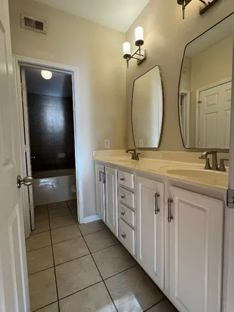 a bathroom with a toilet and a bath tub