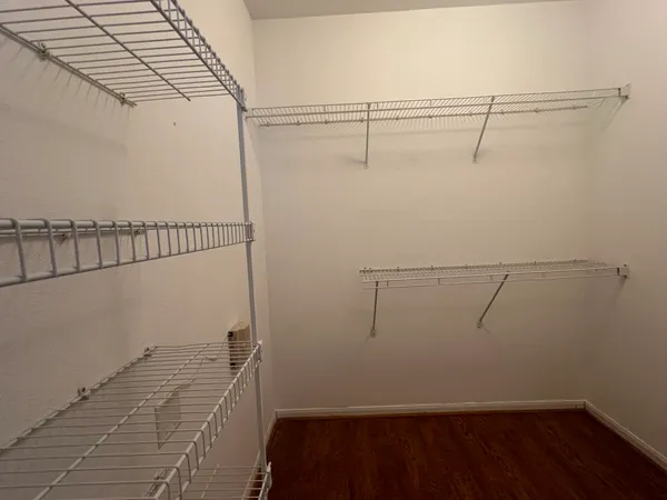 a view of a room with racks on the wall