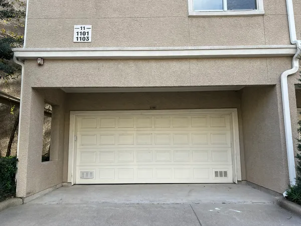 a front view of a house with a garage