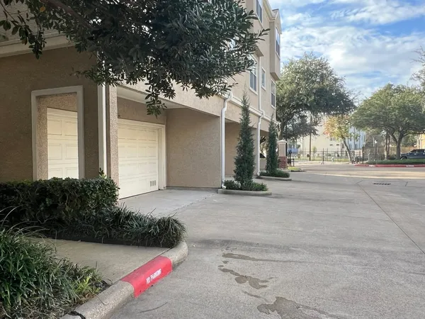 a large building with trees in front of it