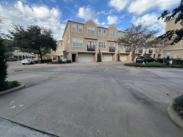 a view of a street with a building