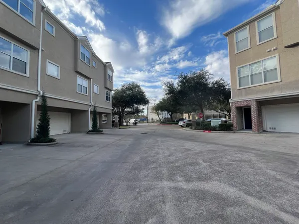 a view of a street with a building in the background