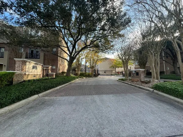 a view of a street with a building in the background