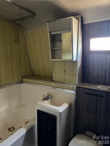 a bathroom with a sink and mirror