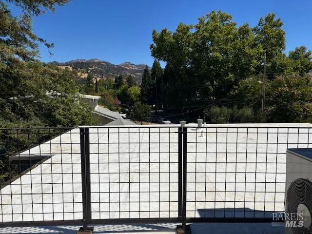 a view of a table and chairs in the patio
