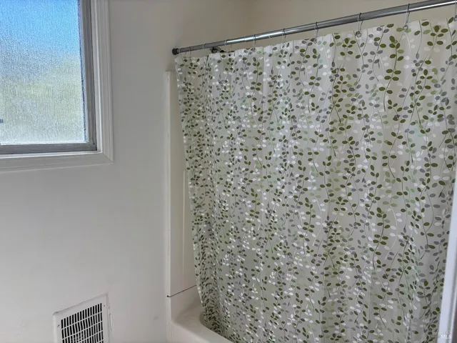 a bathroom with a shower curtain