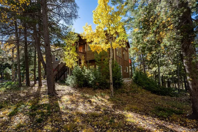 a backyard of a house with lots of green space