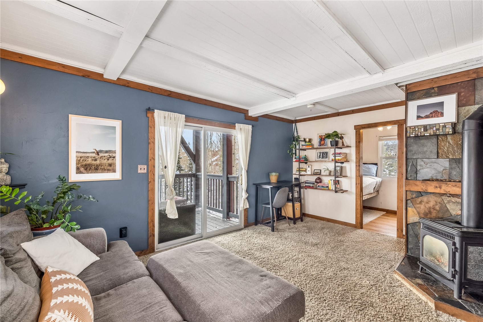 8032 Ryan Gulch Road, Unit D5 Silverthorne, CO 80498 - Photo 1 of 24 Cozy living room with walk-out deck.