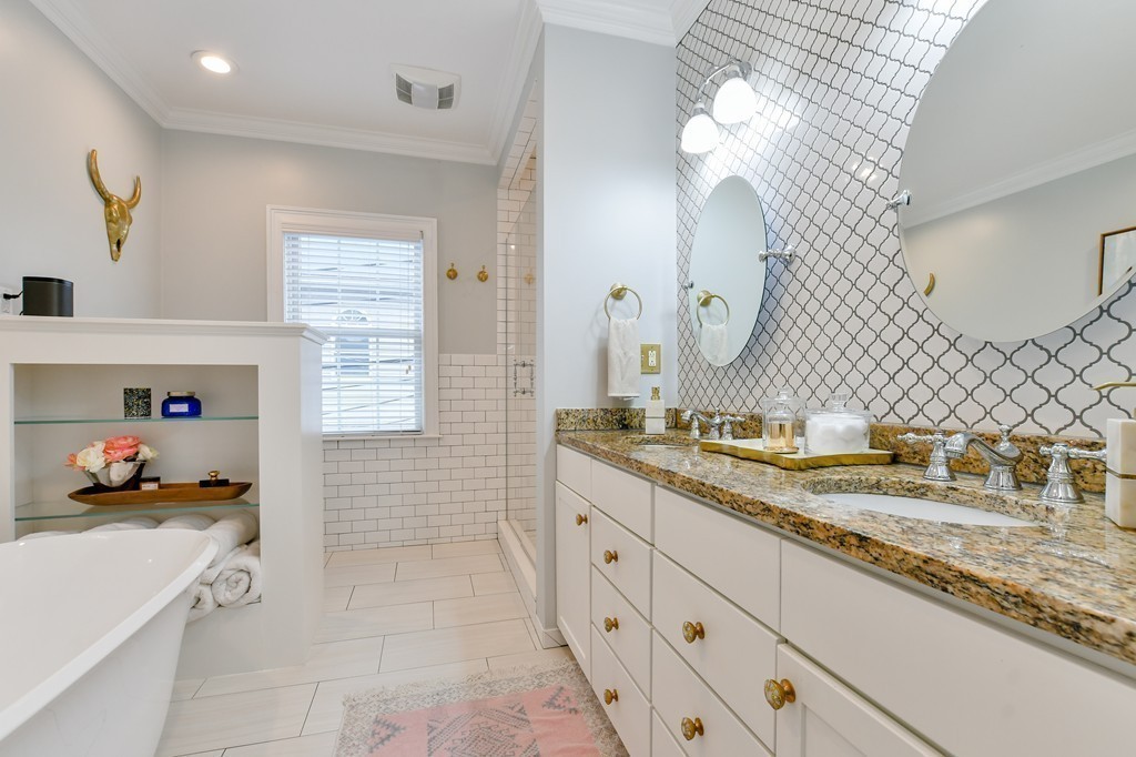 155 H Street, Unit 2 Boston, MA 02127 - Photo 12 of 20 a spacious bathroom with a granite countertop sink a mirror and a shower