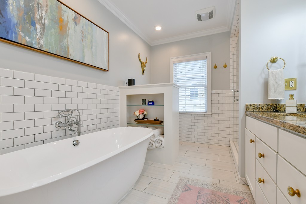 155 H Street, Unit 2 Boston, MA 02127 - Photo 14 of 20 a bathroom with a tub a sink and a shower
