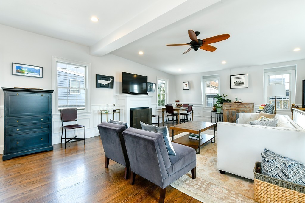 155 H Street, Unit 2 Boston, MA 02127 - Photo 2 of 20 a living room with fireplace furniture and a flat screen tv
