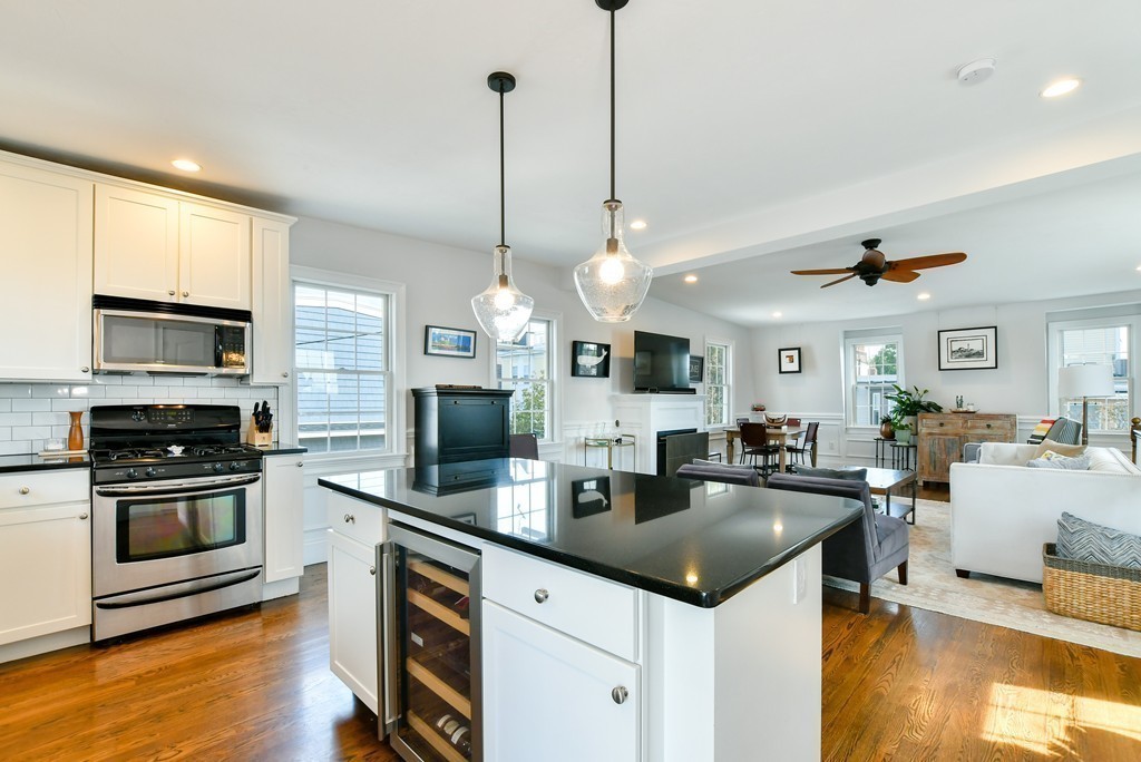 155 H Street, Unit 2 Boston, MA 02127 - Photo 8 of 20 a kitchen with stainless steel appliances granite countertop a sink a stove and a wooden floors